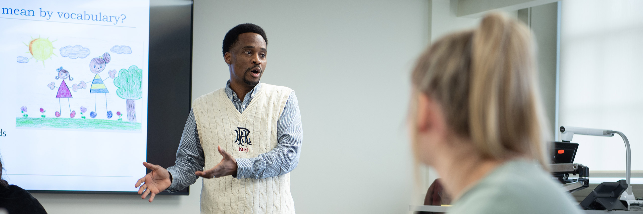 Professor lecturing in a classroom